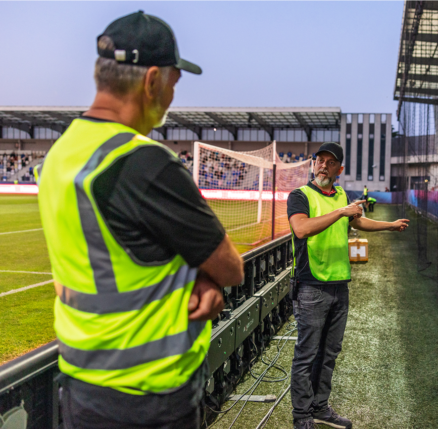 Security personnel at a soccer stadium event.